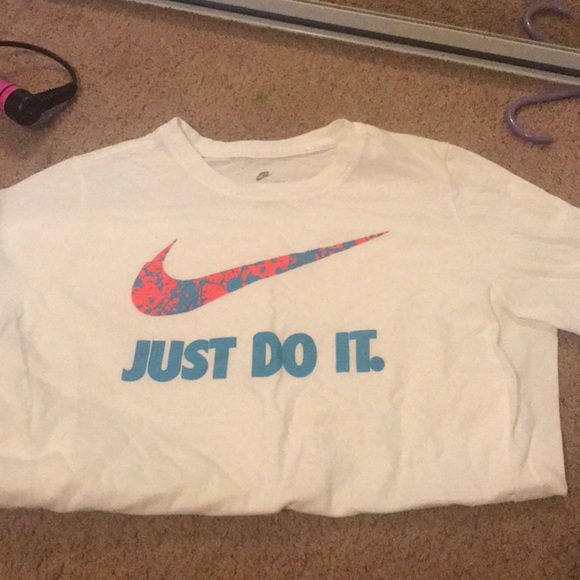 white pink and blue nike shirt